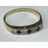 A 9 CARAT GOLD 'I LOVE YOU' RING WITH THREE SAPPHIRES AND FOUR CUBIC ZIRCONIAS SIZE O/P
