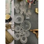 A COLLECTION OF CUT GLASS CRYSTAL ITEMS TO INCLUDE AN EDINBURGH CRYSTAL CLOCK, VASES, BOWLS, ETC