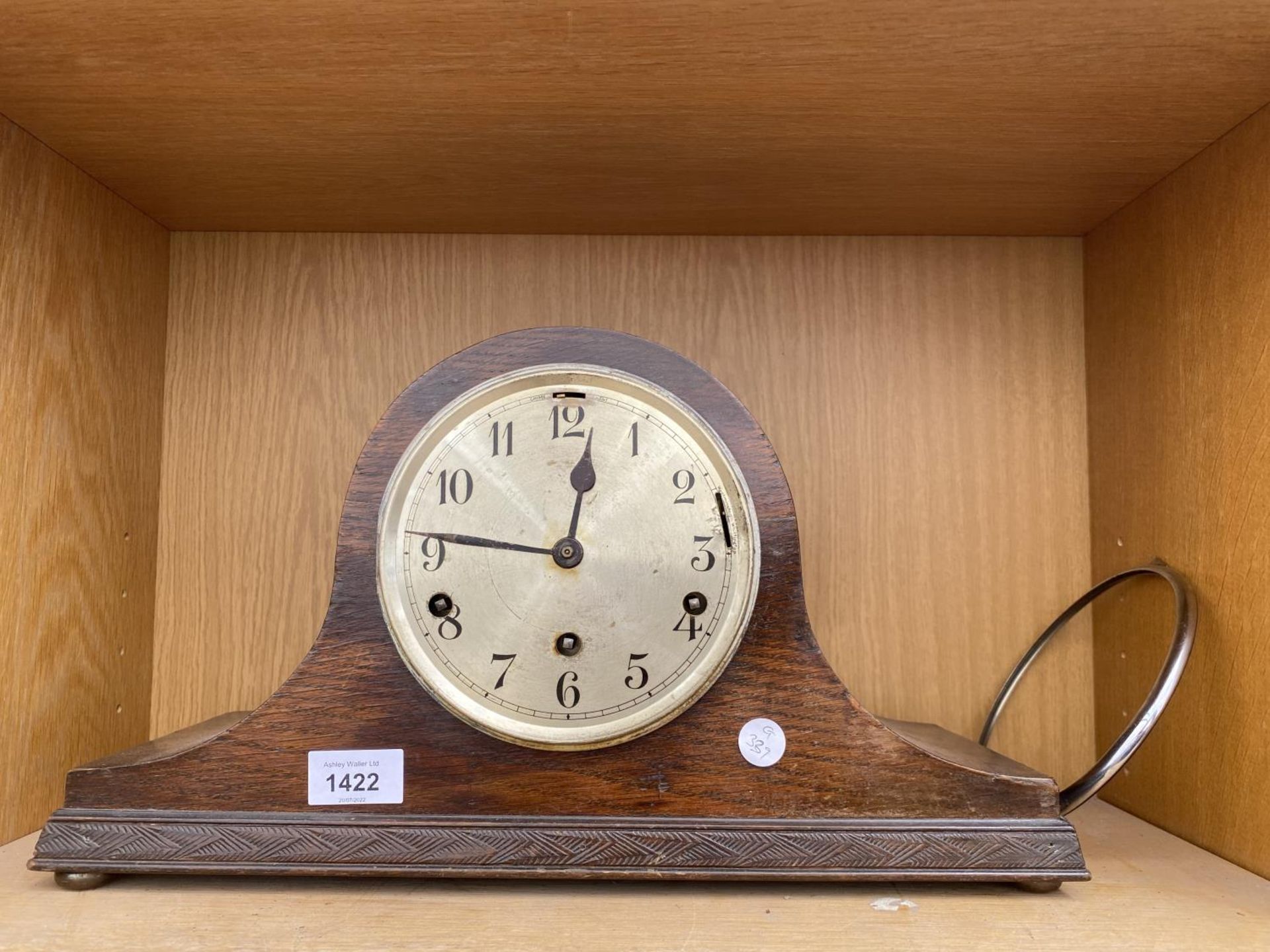 AN OAK CASED NAPOLEON HAT MANTLE CLOCK