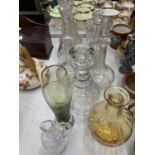 A QUANTITY OF GLASSWARE TO INCLUDE FIVE DECANTERS, VASES, ETC