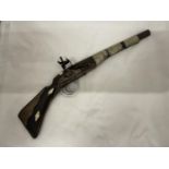 A VINTAGE GUN WITH METAL BANDING TO THE BARREL AND HILT LENGTH APPROX 52CM