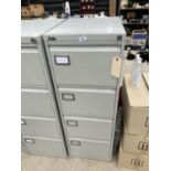 A SILVERLINE FOUR DRAWER FILING CABINET WITH KEY