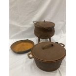 THREE VINTAGE CAST IRON POTS AND PANS TO INCLUDE LIDDED COOKING POTS