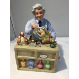 A ROYAL DOULTON FIGURE 'THE CHINA REPAIRER' HN 2943 HEIGHT APPROX 17CM