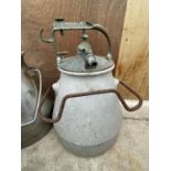 A GALVANISED MILK BUCKET WITH A CLUSTER ATTACHMENT LID