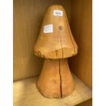 A WOODEN MUSHROOM