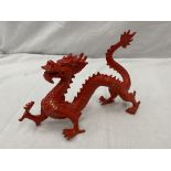A METAL SCULPTURE OF A RED DRAGON HEIGHT 17CM, LENGTH APPROX 28CM