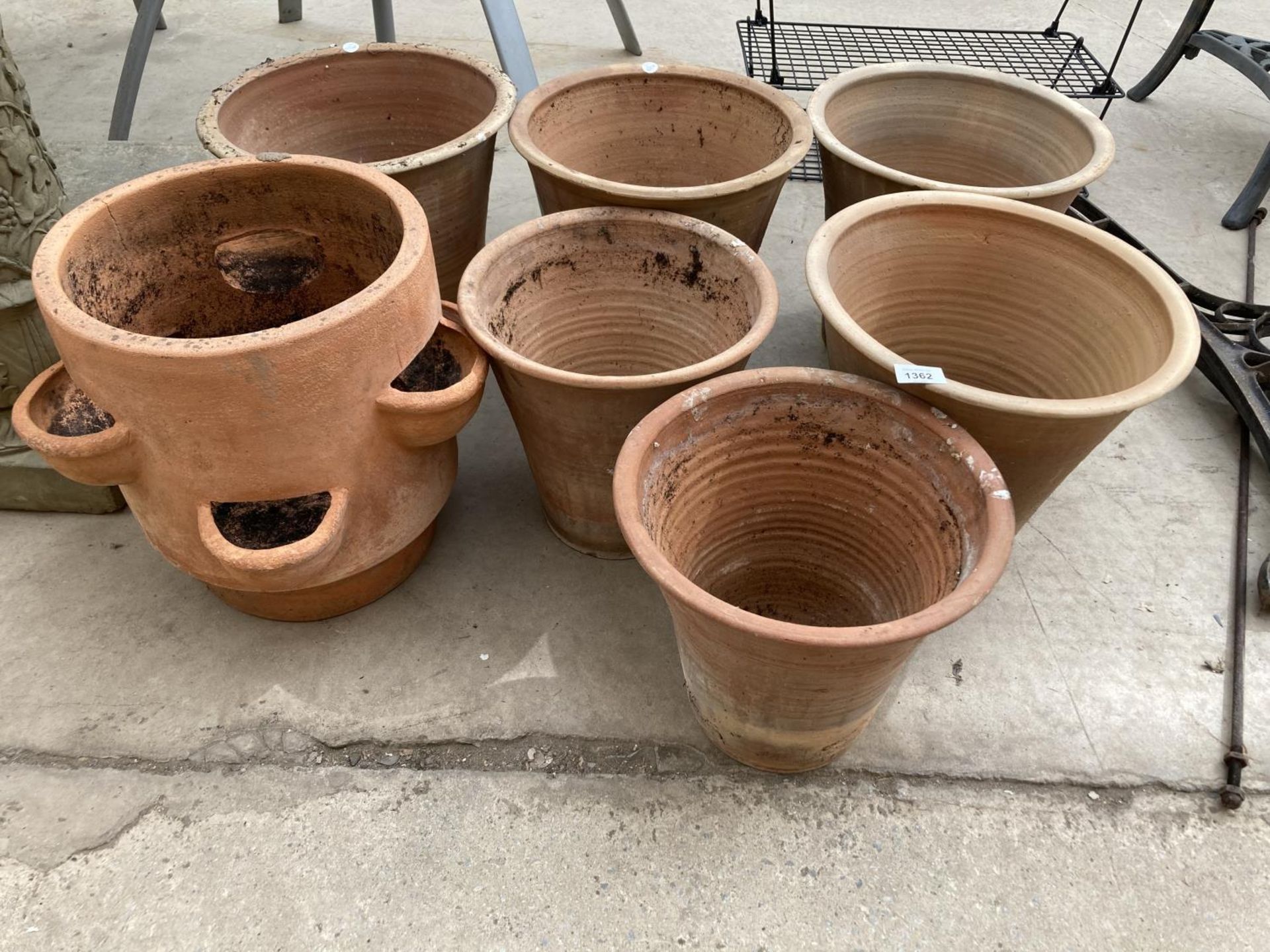 SEVEN LARGE TERRACOTTA PLANTERS TO INCLUDE A STRAWBERRY/HERB POT