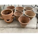 SEVEN LARGE TERRACOTTA PLANTERS TO INCLUDE A STRAWBERRY/HERB POT