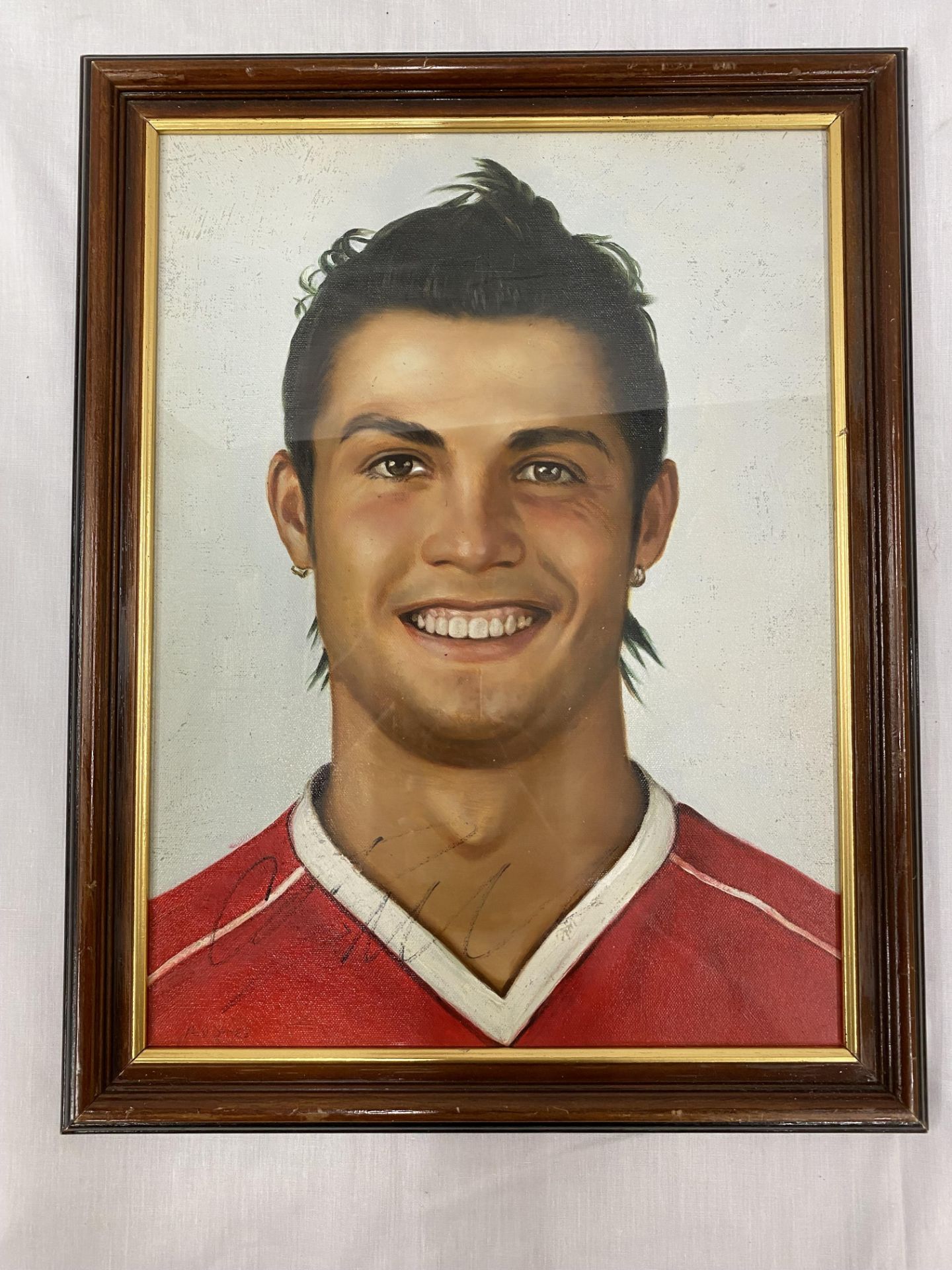 A SIGNED CRISTIANO RONALDO OIL PAINTING 37CM X 47CM - NO PROVENANCE