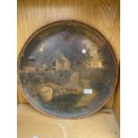 A LARGE VINTAGE CIRCULAR METAL TRAY WITH A RIVER SCENE