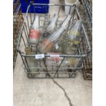 A VINTAGE MILK CRATE WITH THIRTEEN LOCAL INTEREST MILK BOTTLES TO INCLUDE J D BULLOCK, HE MOSS, NW &