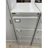 A SILVERLINE FOUR DRAWER FILING CABINET WITH KEY
