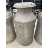 A VINTAGE MILK CHURN