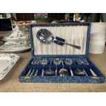 A VINTAGE BOXED SET OF DESSERT SPOONS, FORKS AND A SERVING SPOON WITH FLUTED BOWLS