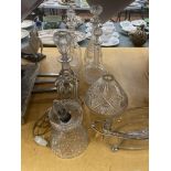 EIGHT CUT GLASS DECANTERS, VASES, LAMPS ETC.