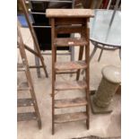 A PAIR OF VINTAGE FIVE RUNG STEP LADDERS