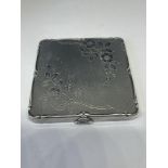 A POSSIBLY SILVER COMPACT WITH MIRROR (ENGRAVED)