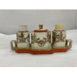 AN ORANGE AND GILT NORITAKE CRUET SET AND AN ART DECO CRUET SET