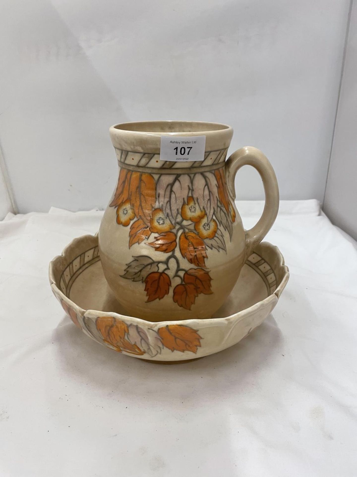 A CHARLOTTE RHEADE STYLE LARGE BOWL DIAMETER 25CM AND JUG HEIGHT 22CM