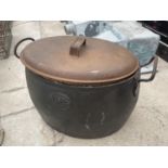 A LIDDED CAST IRON COOKING POT MARKED J & W FINDLAY