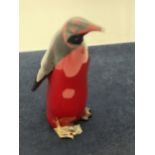 A ROYAL DOULTON FLAMBE PENGUIN AF - DAMAGE TO BEAK AND FOOT) - 15 CM