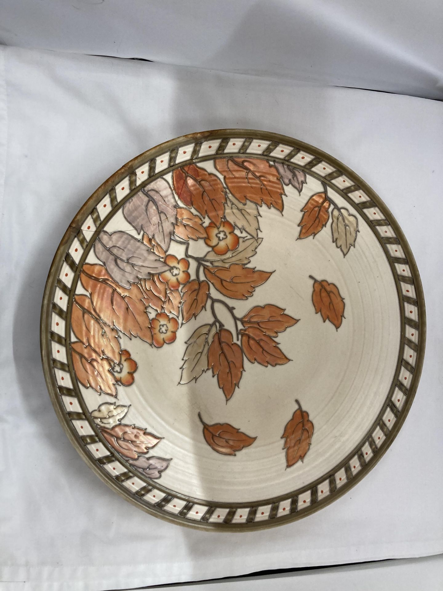 A LARGE CHARLOTTE RHEAD DECORATED CHARGER DIAMETER 43.5CM