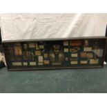 A LARGE MAHOGANY AND GLASS WALL MOUNTED DISPLAY CASE CONTAINING EGYPTIAN ARTEFACTS WITH NARRATIVE