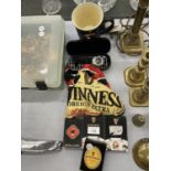 A COLLECTION OF GUINNESS ADVERTISING ITEMS TO INCLUDE PLAYING CARDS, A BOXED WATCH, HEADSCARF AND