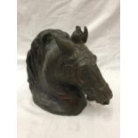 A BRONZED STONE HORSES HEAD HEIGHT 29CM