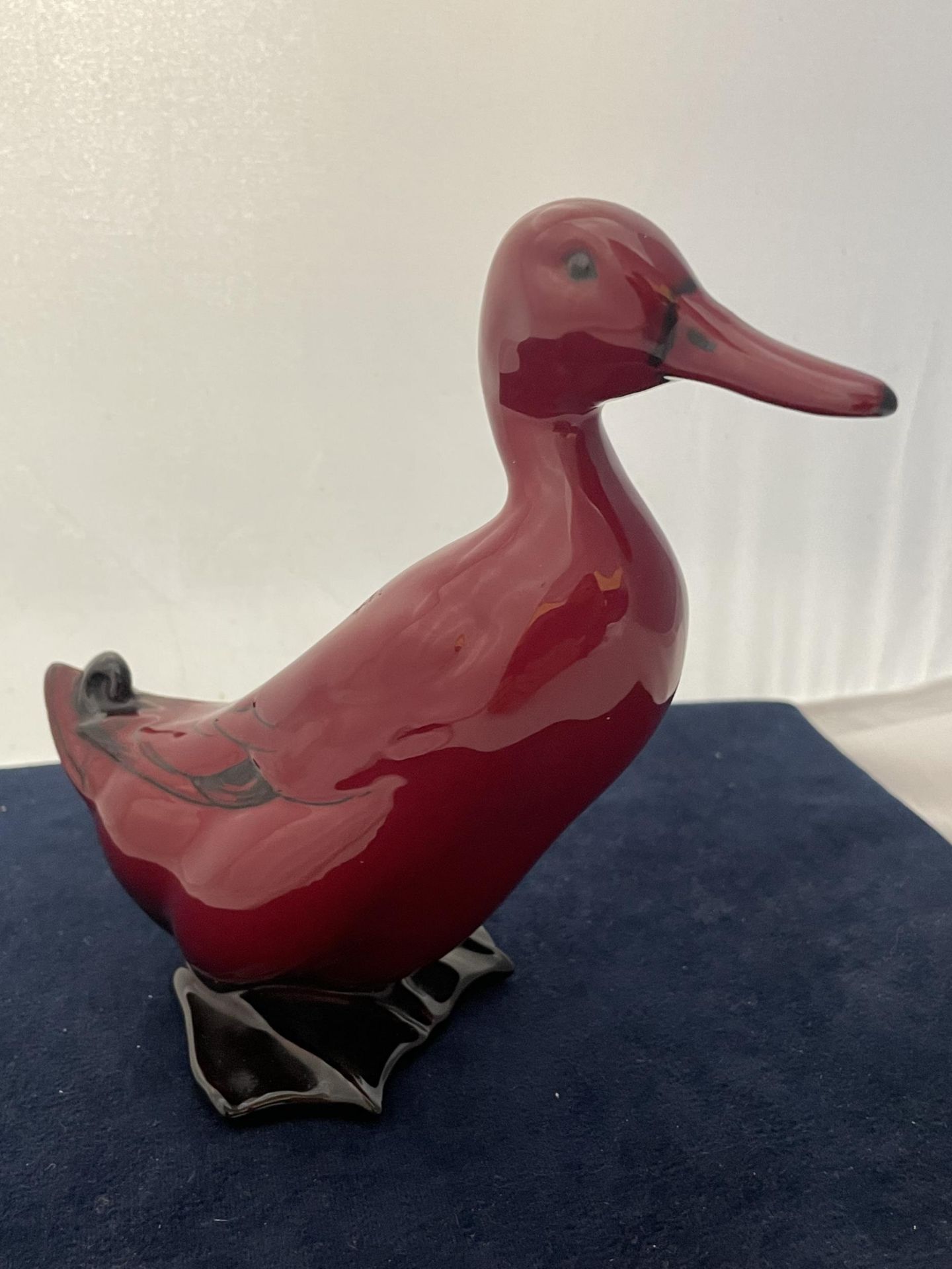 A ROYAL DOULTON FLAMBE DUCK - 16 CM