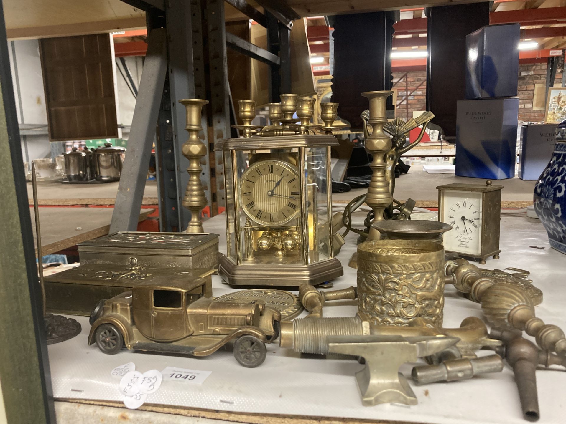 A LARGE COLLECTION OF BRASS ITEMS TO INCLUDE CANDLESTICKS, ANNIVERSARY CLOCK, BOXES, TAPS, VINTAGE