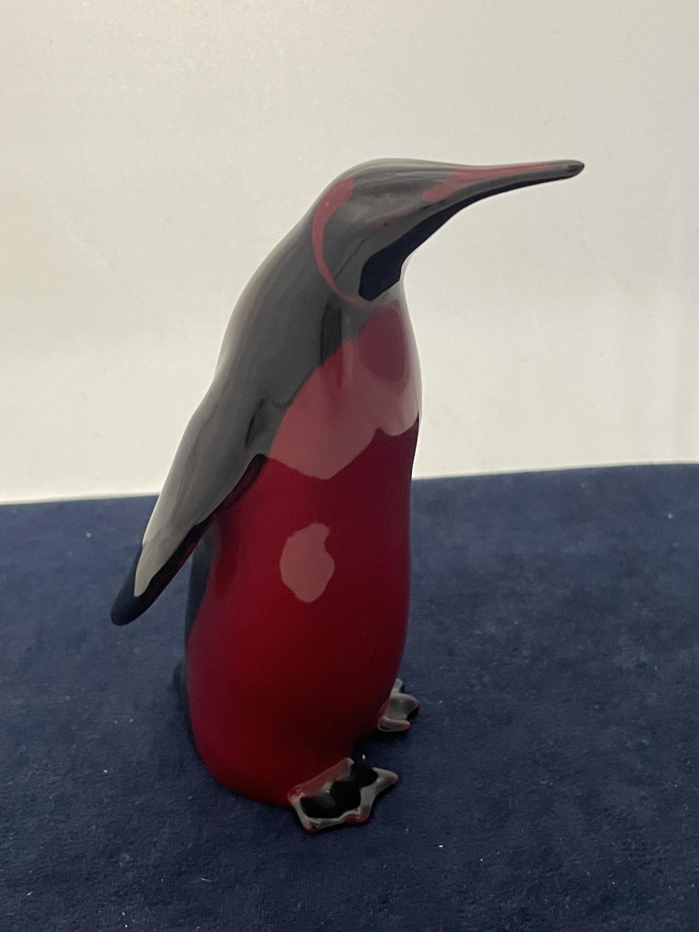 A ROYAL DOULTON FLAMBE PENGUIN - 15 CM