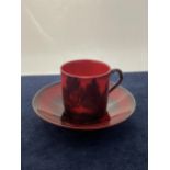 A ROYAL DOULTON FLAMBE CUP AND SAUCER- 6 CM