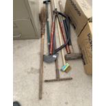 VARIOUS TOOLS TO INCLUDE A RAKE, LUMP HAMMER, BOW SAW ETC