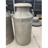 A VINTAGE MILK CHURN