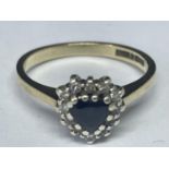 A 9 CARAT GOLD RING WITH SAPPHIRES AND DIAMONDS IN A HEART SHAPE SIZE L/M