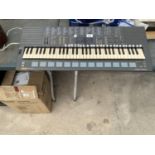 A YAMAHA MUSIC STATION KEYBOARD