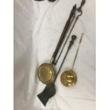 A COPPER AND BRASS BED WARMING PAN, FIRE TONGS, SHOVEL AND A BRASS CHESTNUT ROASTING PAN