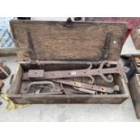 A LARGE WOODEN TOOLBOX WITH CONTENTS TO INCLUDE LARGE HINGES ETC