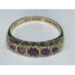 A 9 CARAT GOLD RING WITH FIVE IN LINE AMETHYSTS SIZE L/M