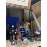 A QUANTITY OF GLASSWARE TO INCLUDE BOTTLES, VASES, NOVELTY DECANTERS, ETC
