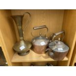TWO COPPER AND BRASS KETTLES AND A BRASS EWER