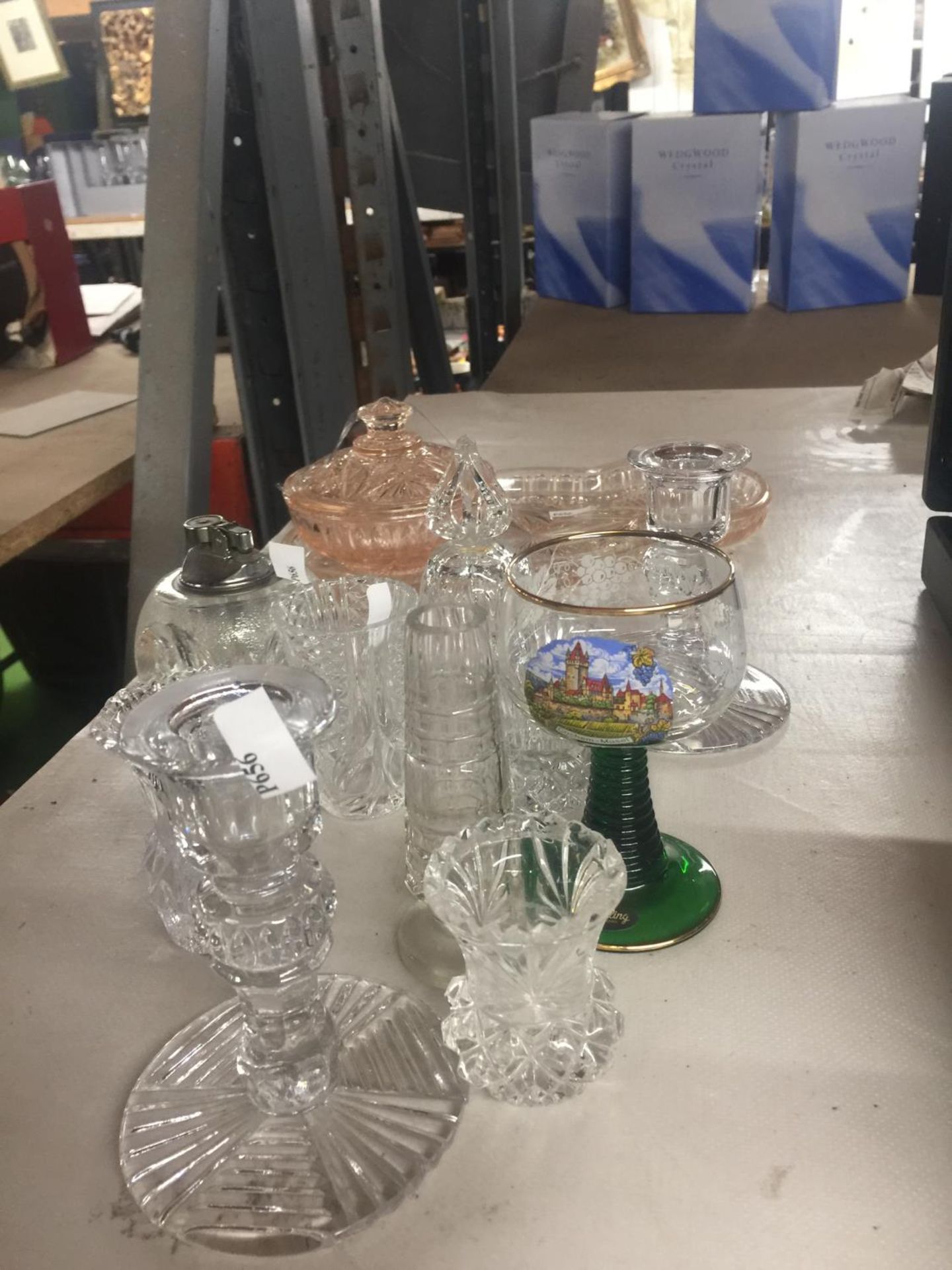 A QUANTITY OF GLASSWARE TO INCLUDE CANDLESTICKS, A GREEN STEMMED MOSELLE GLASS, SMALL VASES, GLASS