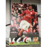 A LARGE WALL CANVAS OF CRISTIANO RONALDO PLAYING FOR MANCHESTER UNITED H: 92 CM