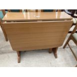 A SUTHERLAND STYLE DROP-LEAF TABLE WITH FORMICA TOP