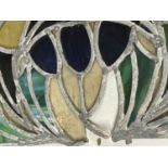 A PIECE OF ARCHED LEADED GLASS WINDOW (A/F)