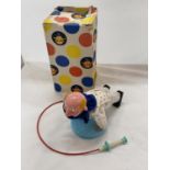 A VINTAGE TIN PLATE TOY CLOWN