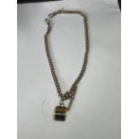 A GOLD PLATED DOUBLE ALBERT WTACH CHAIN WITH T BAR AND FOB