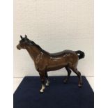 A VINTAGE BESWICK GLOSS BAY HORSE WITH WHITE BLAZE AND A BLACK TAIL AND MANE AND TWO FRONT WHITE